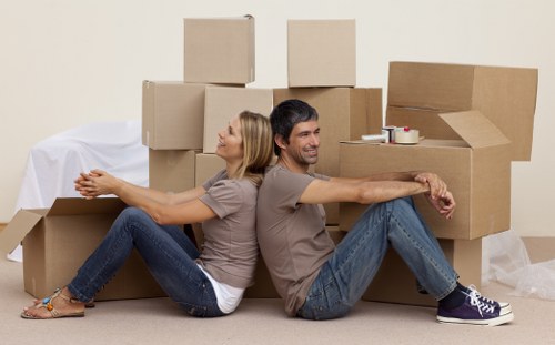 A busy office relocation scene in Soho with professional movers planning the move.